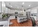 The gourmet kitchen features granite countertops, stainless steel appliances, and a center island at 6801 Louis Dr, Locust Grove, GA 30248