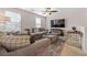 Spacious living room is accentuated by natural light, comfortable seating, and modern accents at 6801 Louis Dr, Locust Grove, GA 30248