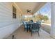 Covered outdoor patio with ceiling fan and cushioned seating, perfect for relaxing at 6801 Louis Dr, Locust Grove, GA 30248