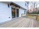 A spacious back deck with wood flooring, sliding glass doors and overhead awning at 1919 Pair Sw Rd, Marietta, GA 30008