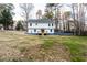 Large backyard and a house with a deck in the background at 1919 Pair Sw Rd, Marietta, GA 30008