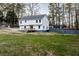 Expansive backyard of a two-story home, featuring a wooden deck and plenty of green space at 1919 Pair Sw Rd, Marietta, GA 30008