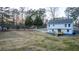 Aerial view of the backyard showing a new deck on a freshly renovated home at 1919 Pair Sw Rd, Marietta, GA 30008