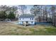 Aerial view of the backyard showing a new deck on a freshly renovated home at 1919 Pair Sw Rd, Marietta, GA 30008