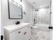 Bathroom featuring a white vanity, white countertop, modern fixtures and black accents at 1919 Pair Sw Rd, Marietta, GA 30008