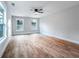 Large bedroom with hardwood floors, windows, and ceiling fan for comfort at 1919 Pair Sw Rd, Marietta, GA 30008