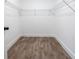 Walk-in closet with hardwood floors and wire shelving for efficient storage at 1919 Pair Sw Rd, Marietta, GA 30008