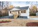 Well maintained two-story home with a covered front porch and manicured landscaping at 1919 Pair Sw Rd, Marietta, GA 30008