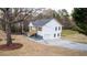 Charming two-story home with a neatly landscaped yard and a long driveway at 1919 Pair Sw Rd, Marietta, GA 30008
