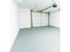 Epoxy floor garage featuring a sectional garage door at 1919 Pair Sw Rd, Marietta, GA 30008