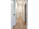 Hallway featuring wood-look flooring, gray walls and white doors and trim at 1919 Pair Sw Rd, Marietta, GA 30008