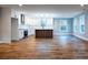 Open concept living room and kitchen features hardwood floors and plenty of natural light at 1919 Pair Sw Rd, Marietta, GA 30008