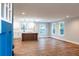 Open concept living room and kitchen features hardwood floors, recessed lighting, and three windows at 1919 Pair Sw Rd, Marietta, GA 30008