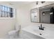 Bathroom with modern vanity, sink, and toilet at 441 Windsor Dr, Forest Park, GA 30297