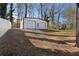 Detached two-car garage or shed with white siding and doors, offering ample storage or workspace at 441 Windsor Dr, Forest Park, GA 30297