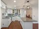 Bright modern kitchen features granite countertops, white cabinetry, and stylish backsplash at 441 Windsor Dr, Forest Park, GA 30297