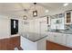 Renovated kitchen featuring granite counters, white cabinetry, and a convenient center island at 441 Windsor Dr, Forest Park, GA 30297