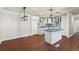 Modern kitchen with granite countertops, white cabinets, and updated stainless steel appliances at 441 Windsor Dr, Forest Park, GA 30297