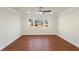 Spacious living room features ceiling fan, new windows and stylish trim at 441 Windsor Dr, Forest Park, GA 30297