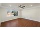 Living room showing new window, ceiling fan and fresh neutral paint at 441 Windsor Dr, Forest Park, GA 30297