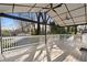 A spacious covered patio with white railing and ceiling fans for outdoor enjoyment at 441 Windsor Dr, Forest Park, GA 30297