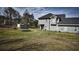 Expansive backyard with storage shed and trampoline, ideal for outdoor activities and storage at 70 Woodcliff Way, Covington, GA 30014