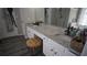 Elegant bathroom featuring double sinks with granite countertops, complemented by modern fixtures and ample lighting at 70 Woodcliff Way, Covington, GA 30014
