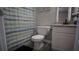 A compact, clean bathroom with a shower-tub combo and a white vanity at 70 Woodcliff Way, Covington, GA 30014
