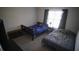 Nicely decorated bedroom with two beds and a large window providing ample light at 70 Woodcliff Way, Covington, GA 30014
