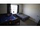Nicely decorated bedroom with two beds and a large window providing ample light at 70 Woodcliff Way, Covington, GA 30014