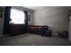 Comfortable bedroom with neutral walls and a large window for ample light at 70 Woodcliff Way, Covington, GA 30014