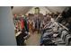 Spacious walk-in closet with ample storage, racks, and shelves for organized and convenient wardrobe management at 70 Woodcliff Way, Covington, GA 30014