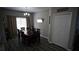 Dining room features a wood table with seating for six, chandelier and gray wood-look floors at 70 Woodcliff Way, Covington, GA 30014