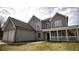 Lovely two-story home with two-car garage and inviting front porch at 70 Woodcliff Way, Covington, GA 30014