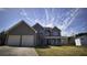Charming two-story home with a covered front porch and a two-car garage, set on a spacious lawn at 70 Woodcliff Way, Covington, GA 30014