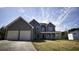 Charming two-story home with a covered front porch and a two-car garage, set on a spacious lawn at 70 Woodcliff Way, Covington, GA 30014