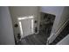 Inviting home foyer with dark laminate flooring, an elegant front door, and a dining area at 70 Woodcliff Way, Covington, GA 30014