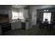 Modern kitchen is open to dining room; featuring white cabinets, granite countertops and stainless steel appliances at 70 Woodcliff Way, Covington, GA 30014