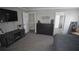 This main bedroom offers a rustic TV stand, dresser, and ensuite bathroom access at 70 Woodcliff Way, Covington, GA 30014