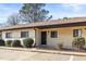 Inviting exterior with manicured bushes, neutral paint, and marked parking spots at 803 New Horizon St, Powder Springs, GA 30127