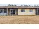 Exterior rear view of the building showing back porches and a yard in need of landscaping at 803 New Horizon St, Powder Springs, GA 30127