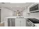 Beautiful kitchen with stainless appliances, new countertops, and a seamless flow to the open-concept living area at 803 New Horizon St, Powder Springs, GA 30127