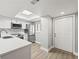 Modern kitchen featuring stainless steel appliances, bright lighting, stone countertops and durable flooring at 803 New Horizon St, Powder Springs, GA 30127