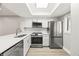 Contemporary kitchen with stainless steel appliances, modern countertops, and bright recessed lighting at 803 New Horizon St, Powder Springs, GA 30127