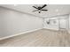 Bright living room with light wood floors adjacent to the open concept kitchen at 803 New Horizon St, Powder Springs, GA 30127