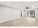 Bright and open living room features light wood floors and a ceiling fan at 803 New Horizon St, Powder Springs, GA 30127