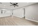 Open-concept living room with light wood flooring connecting seamlessly to the kitchen area at 803 New Horizon St, Powder Springs, GA 30127