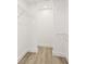 Walk-in closet with wire shelving and light wood laminate flooring at 803 New Horizon St, Powder Springs, GA 30127