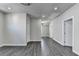 Finished basement with wood floors and recessed lighting, offering versatile space and access to other areas at 1043 Harvest Park Ln, Suwanee, GA 30024
