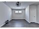 Finished basement features sleek wood floors, recessed lighting and a modern ceiling fan, offering a versatile space at 1043 Harvest Park Ln, Suwanee, GA 30024
